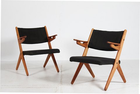 Dansk Møbeldesign
Par lette easy chairs af massiv eg og teak